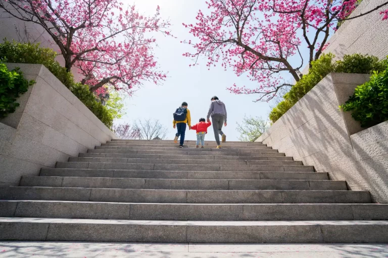 Family going up stairs